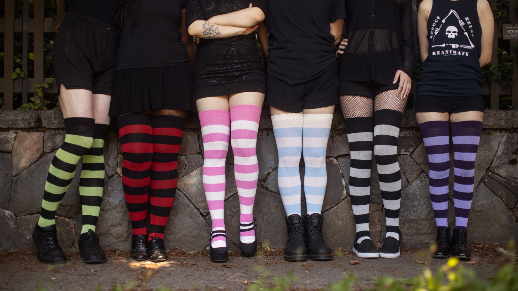 six models in different colorways of Extraordinarily Striped Thigh High Socks