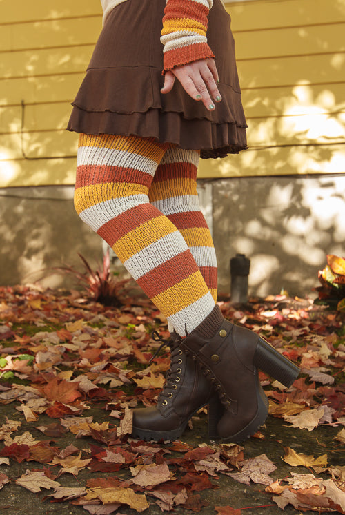 A person wearing Candy Corn striped thigh highs