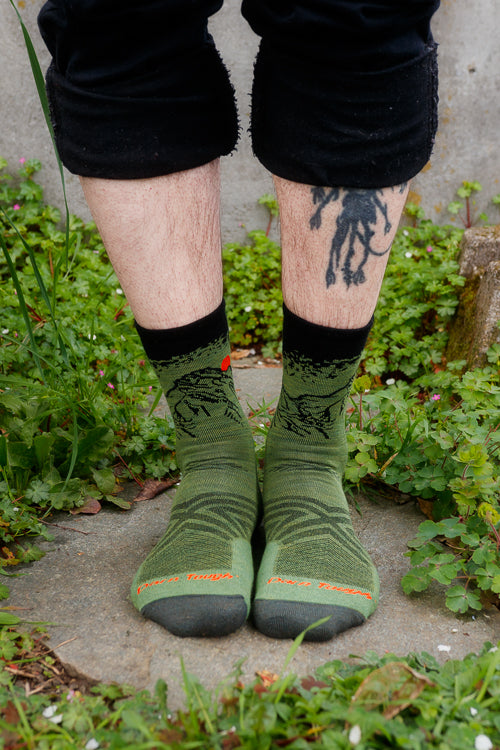 A person wearing vert micro crew in lichen color