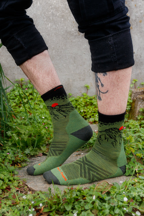 A person wearing vert micro crew in lichen color