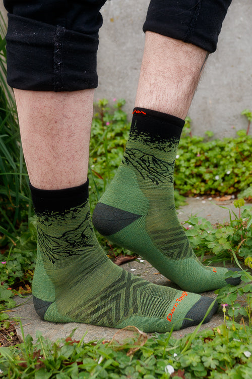 A person wearing vert micro crew in lichen color