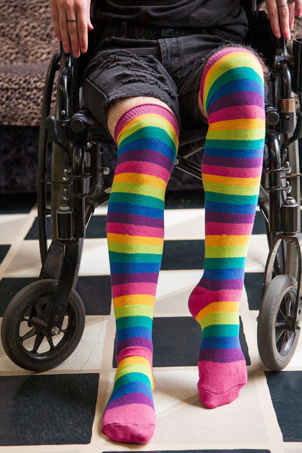 Tall over-the-knee rainbow socks for women have stripes in every color and  are the perfect way to brighten up you…