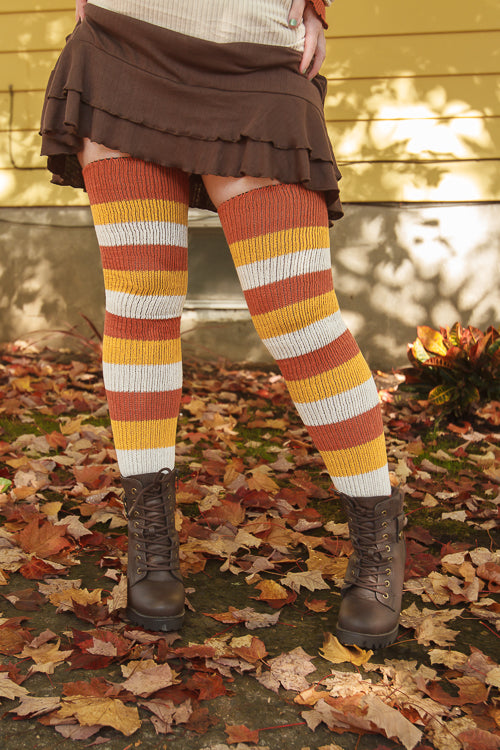 A person wearing Candy Corn striped thigh highs