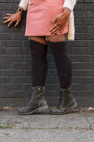 A person wearing Inky Void Chenille Thigh Highs in black