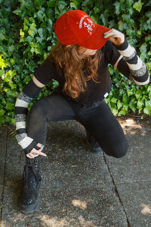 A person wearing cookies and cream stripes warmers