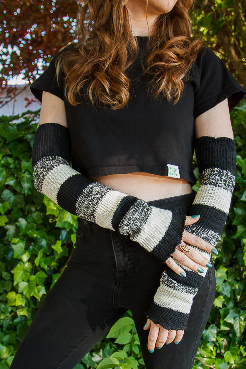 A person wearing cookies and cream stripes warmers