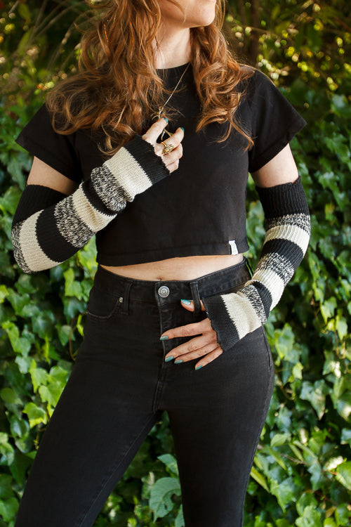 A person wearing cookies and cream stripes warmers