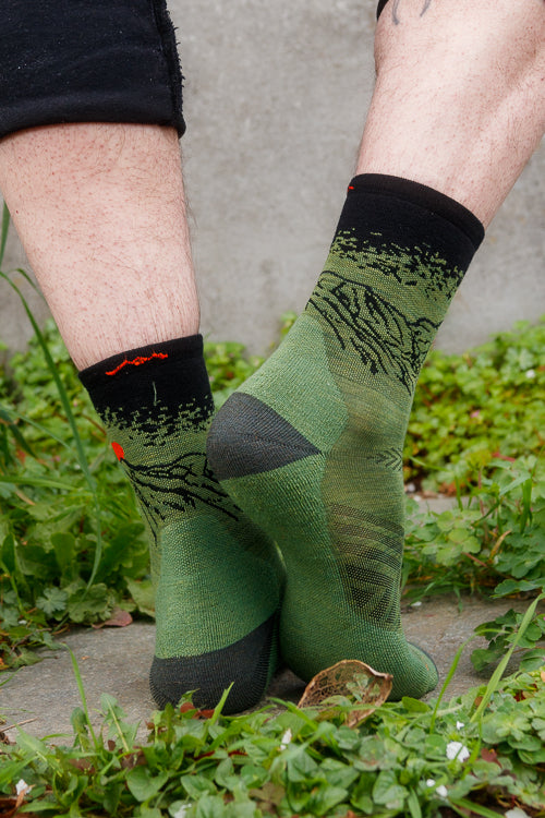 A person wearing vert micro crew in lichen color