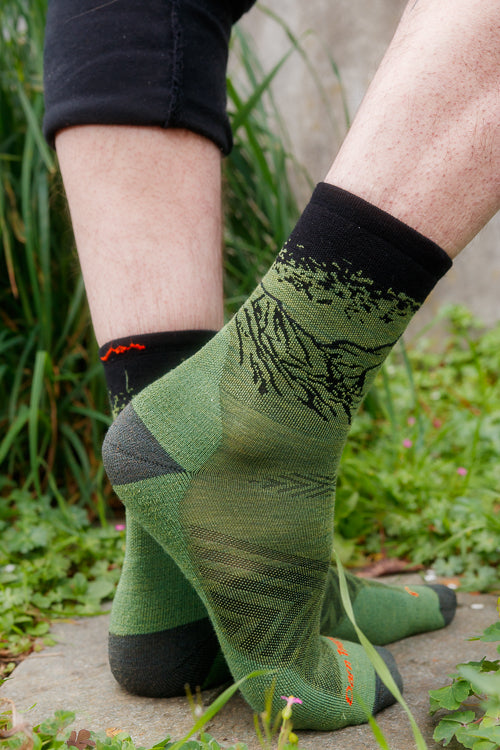 A person wearing vert micro crew in lichen color