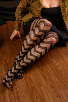 Slinking through the web net tights in black