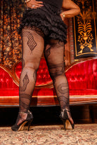 A person wearing plus size snake net tights 