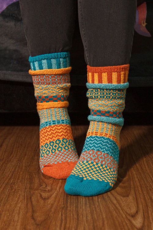 A person wearing Dune crew socks
