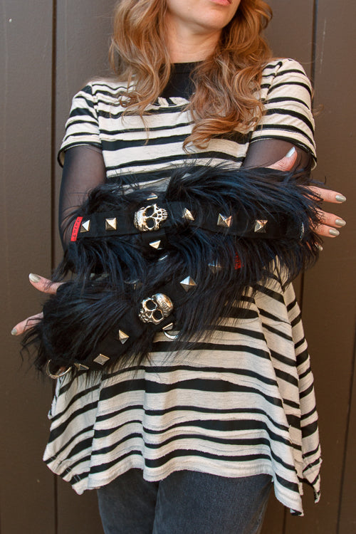 A person wearing Furtastic arm warmers