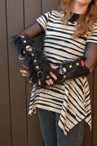 A person wearing Furtastic arm warmers