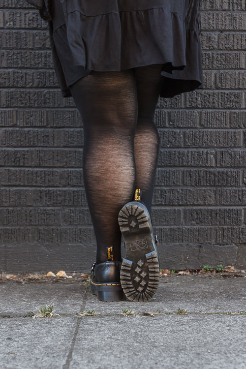 A person wearing Jennifer Wool Tights in black
