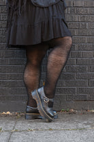 A person wearing Jennifer Wool Tights in black