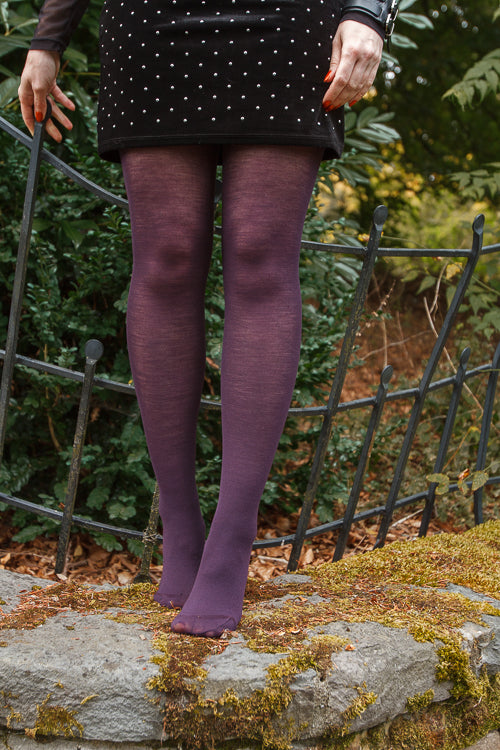 A person wearing Jennifer Wool Tights in prune