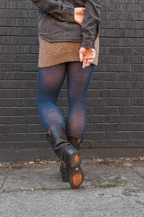 A person wearing Jennifer Wool Tights in sapphire